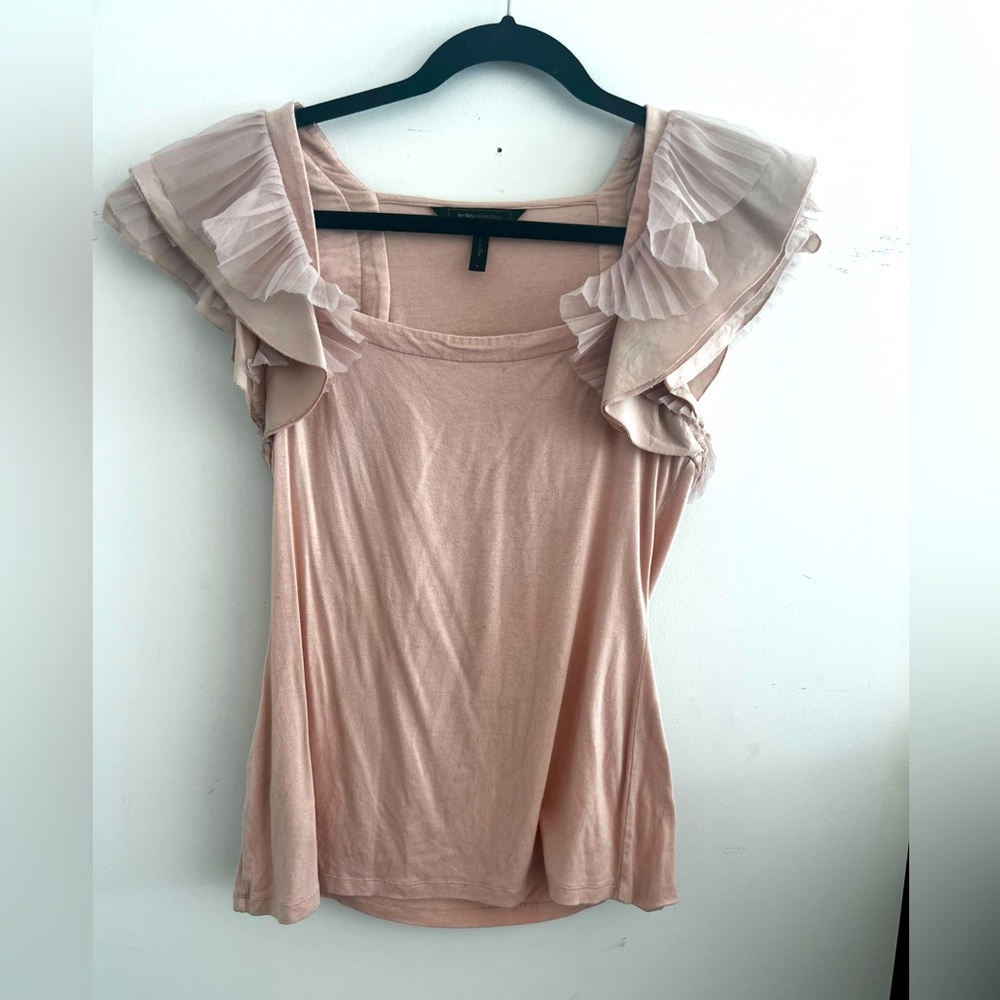Elegant light pink blouse with beautiful shoulder details